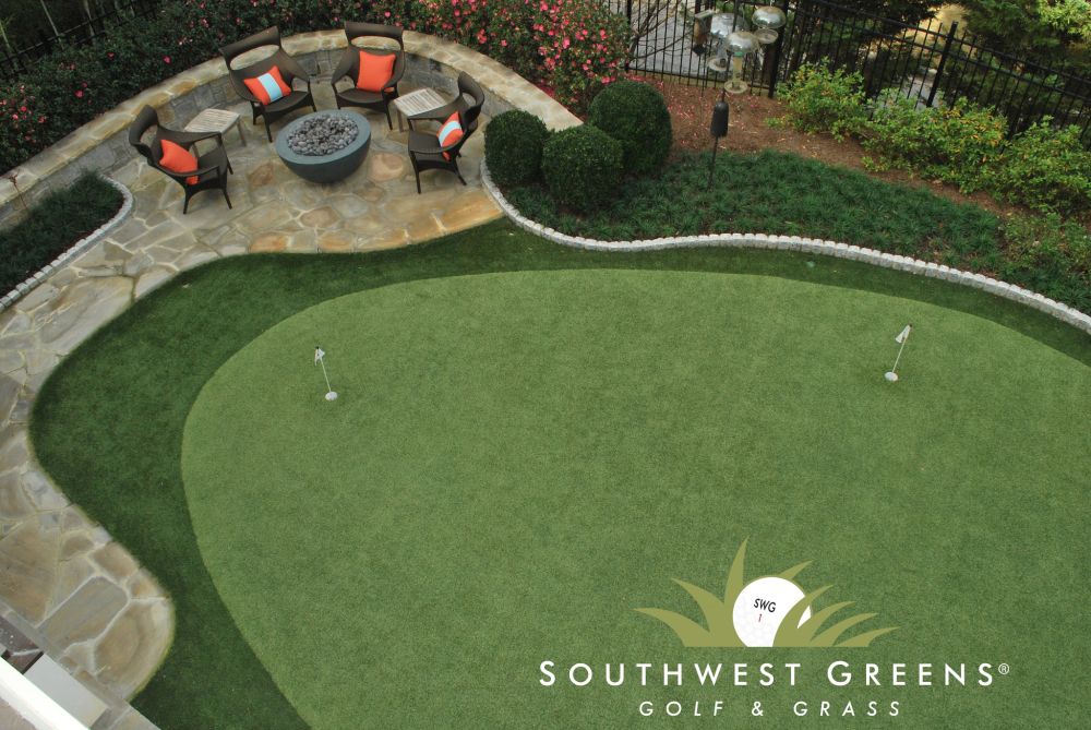 an overhead view of a putting green with chairs beside it